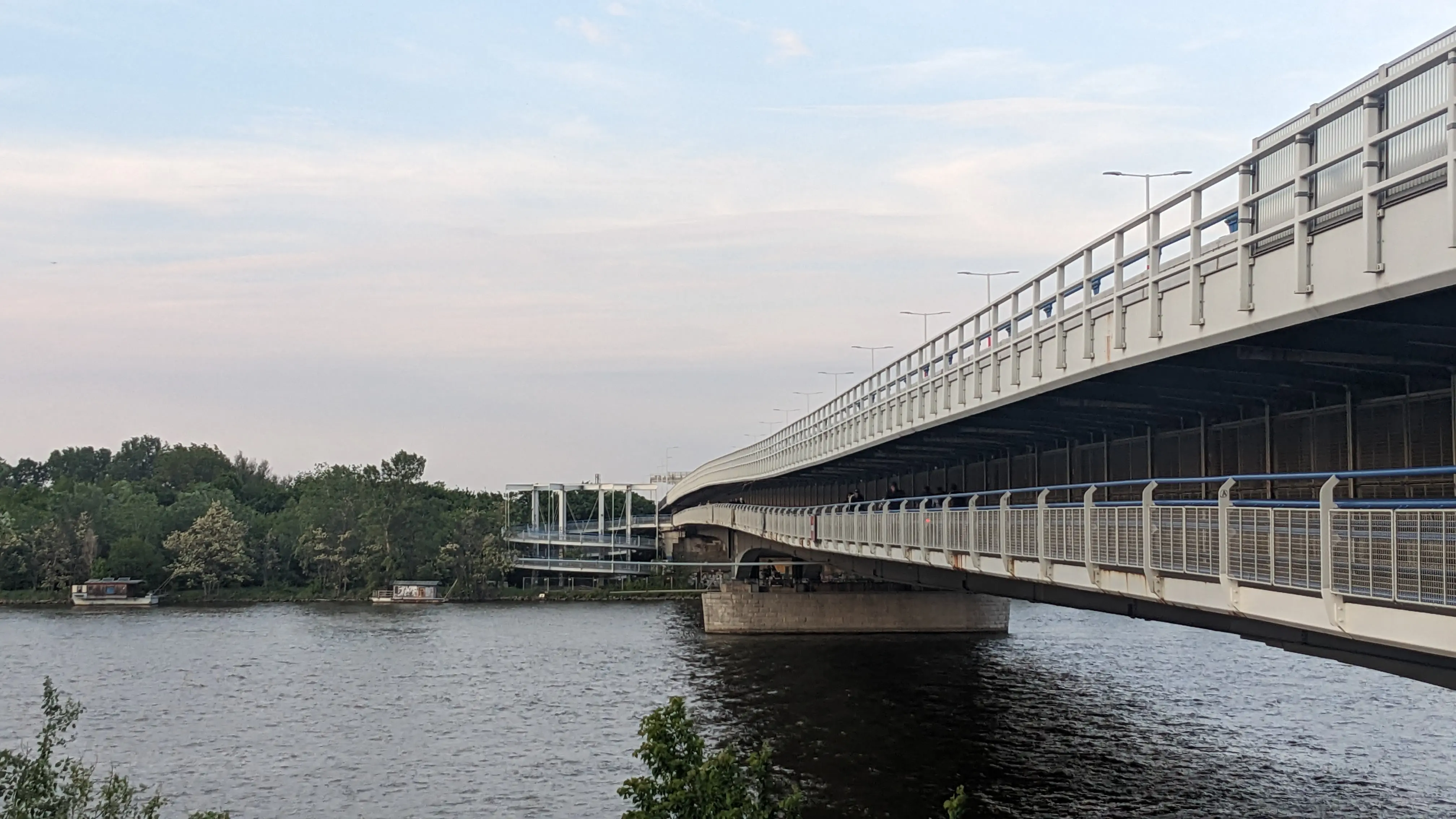 A bike lane on the bottom of a highway bridge