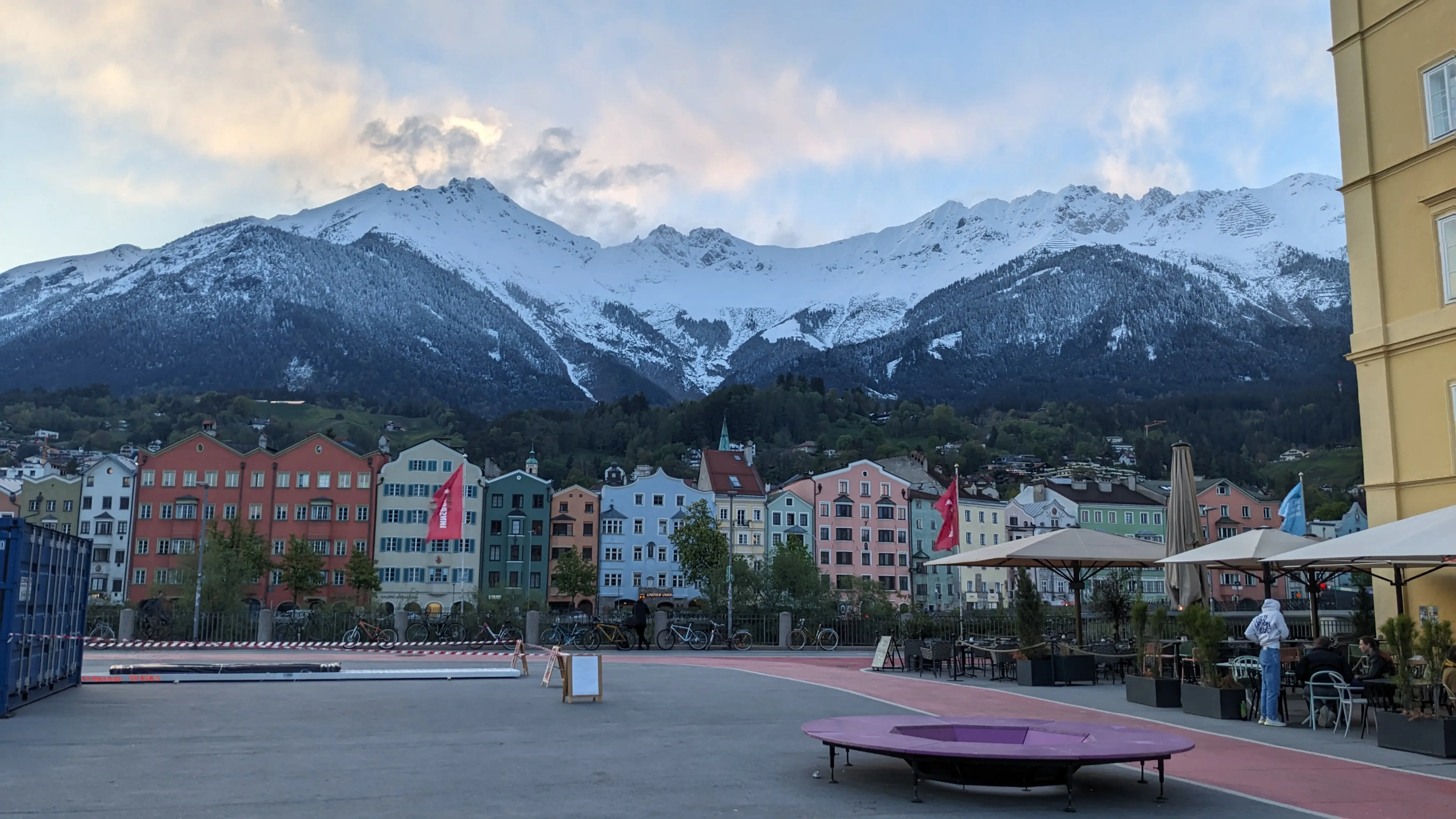 The mountains behind buildings taken from a square