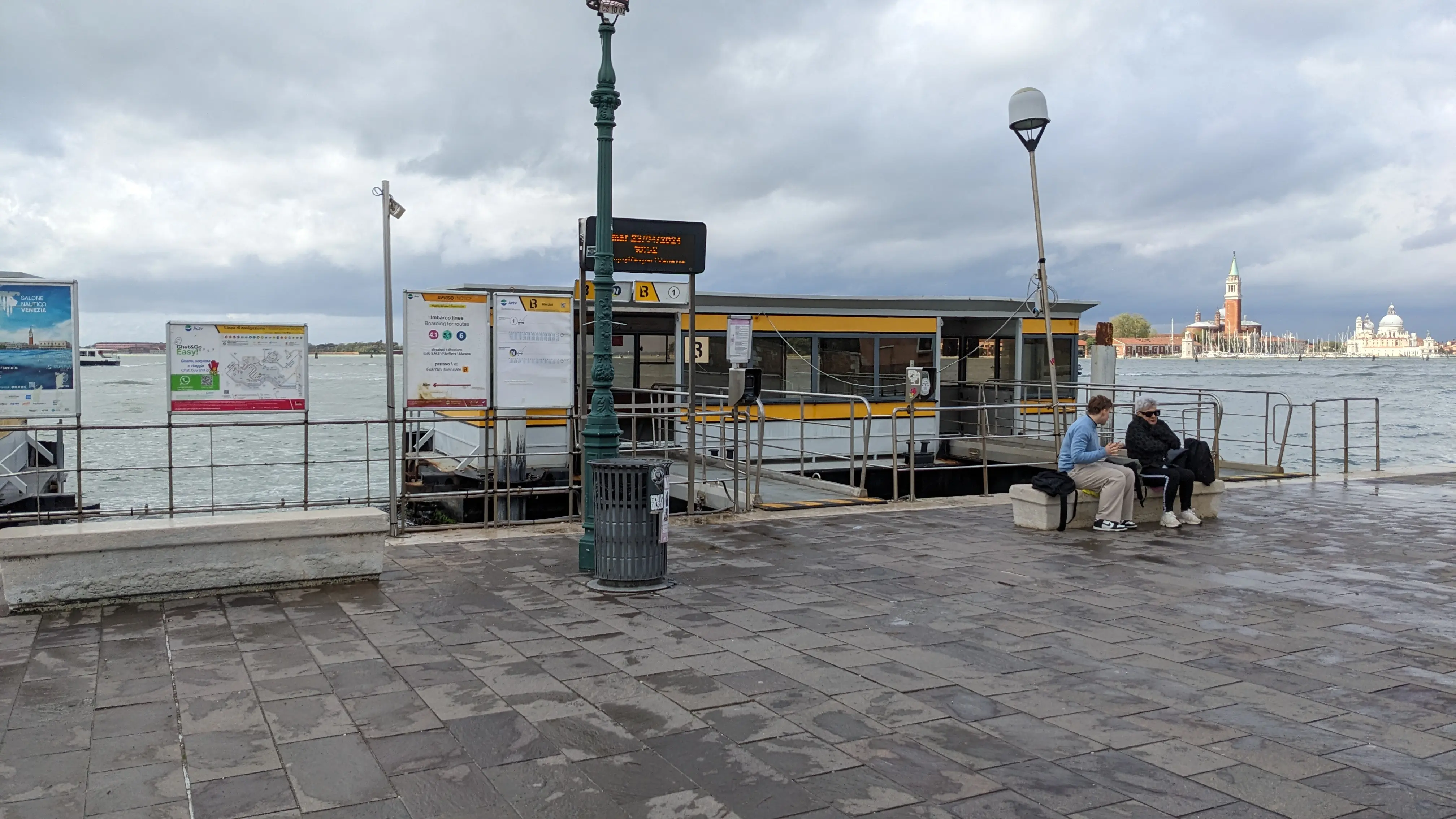 A water bus waiting at a bus stop
