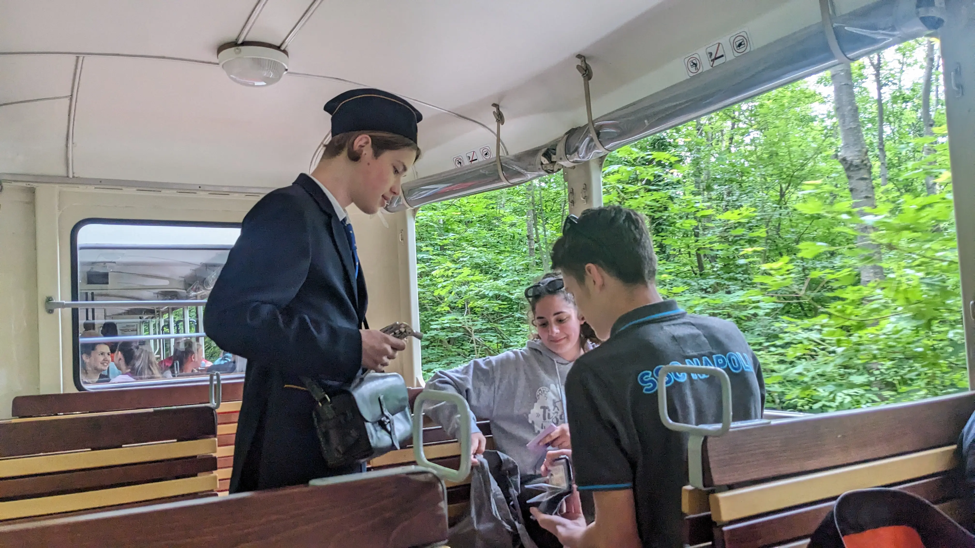 A child checking tickets on the train